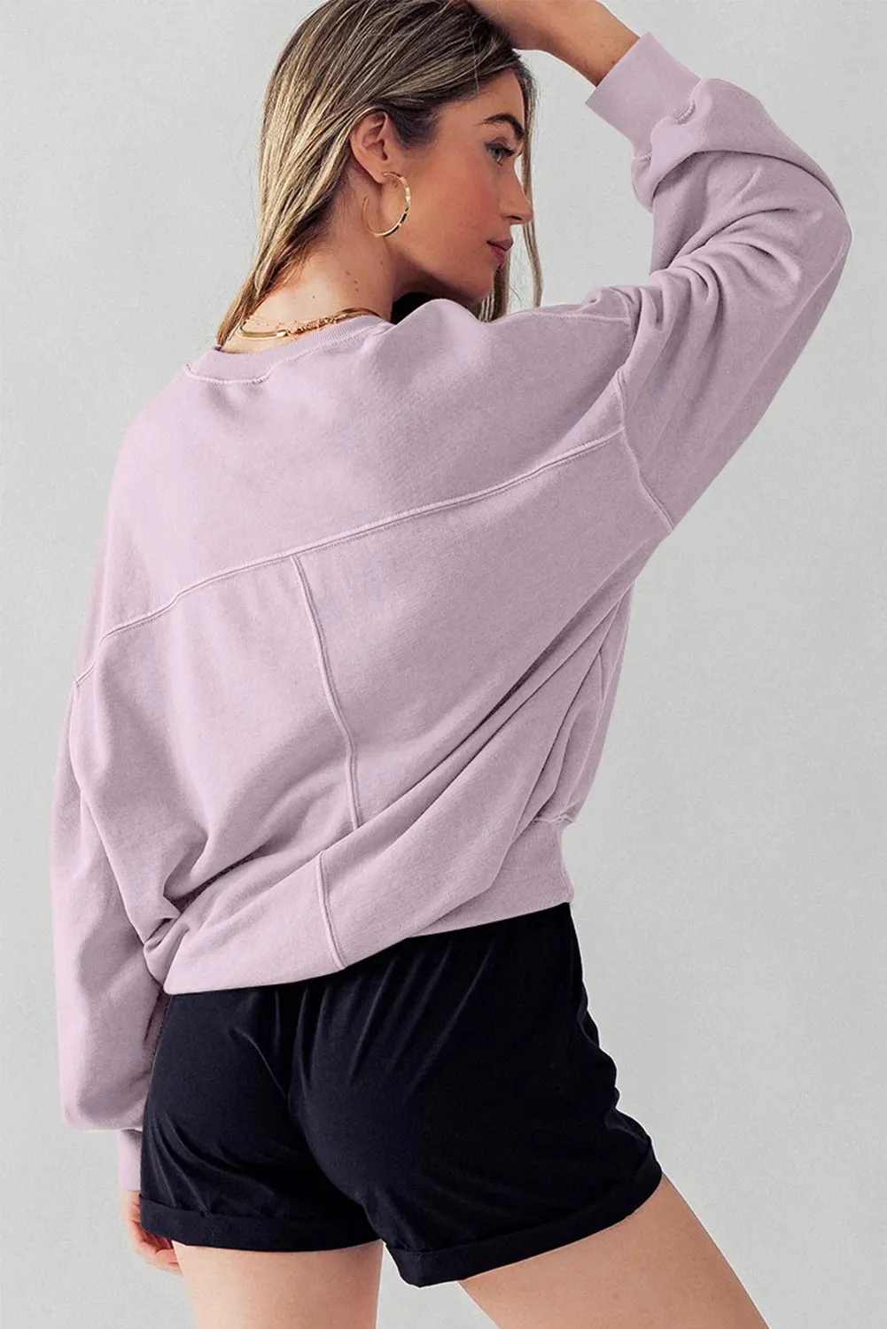 Sweat-shirt à épaules tombantes et manches chauve-souris avec coutures apparentes et pétales d'orchidées